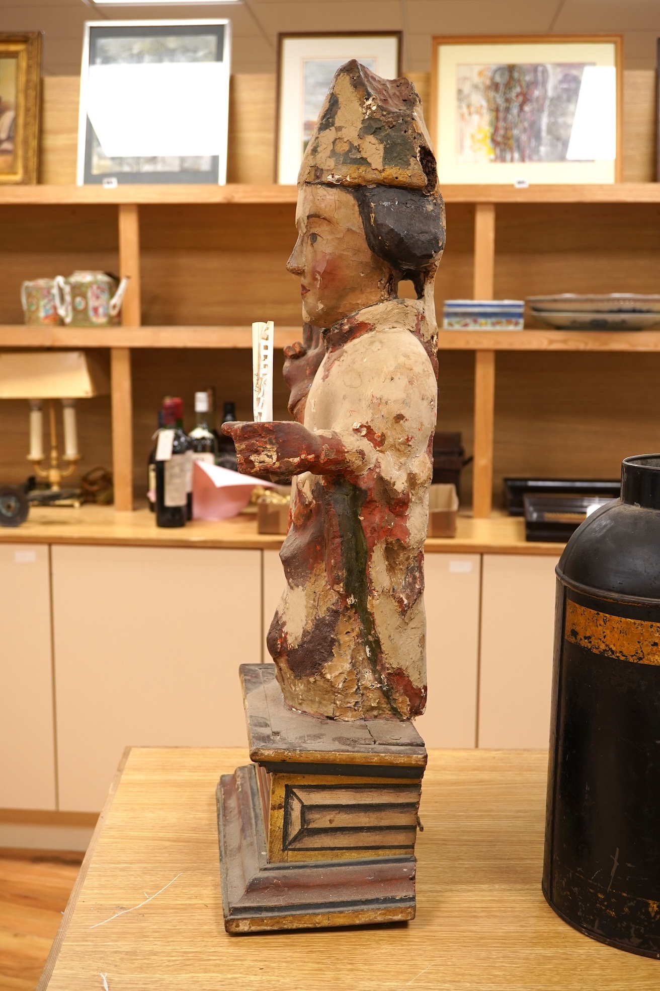A 19th century and later Continental polychrome wood figure of a bishop, 77cm
